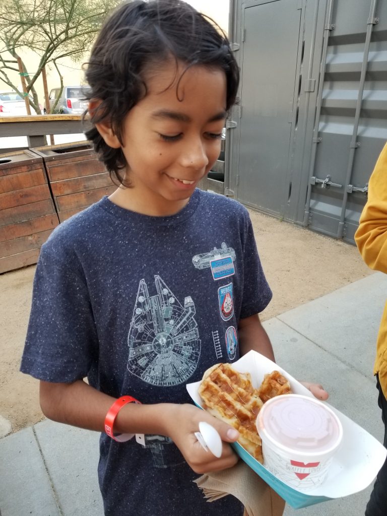 Boy holding waffle