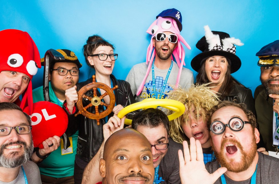 Southern California WordPress Meetup Organizers wearing funny accessories in a photo booth photoshoot